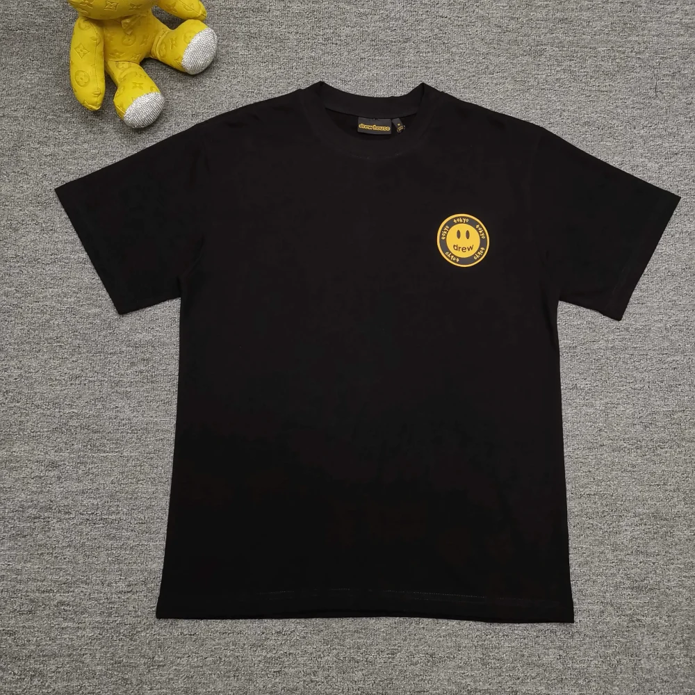 DH Japan Tokyo Limited Kurzärmliges T-Shirt mit Smiley-Print
