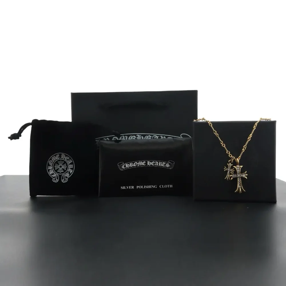 Doppelkreuz-Bambuskette mit grünem Diamanten und Gold