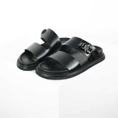 Aquafarbene, flache Lederpantoffeln mit runder Zehenpartie in Schwarz