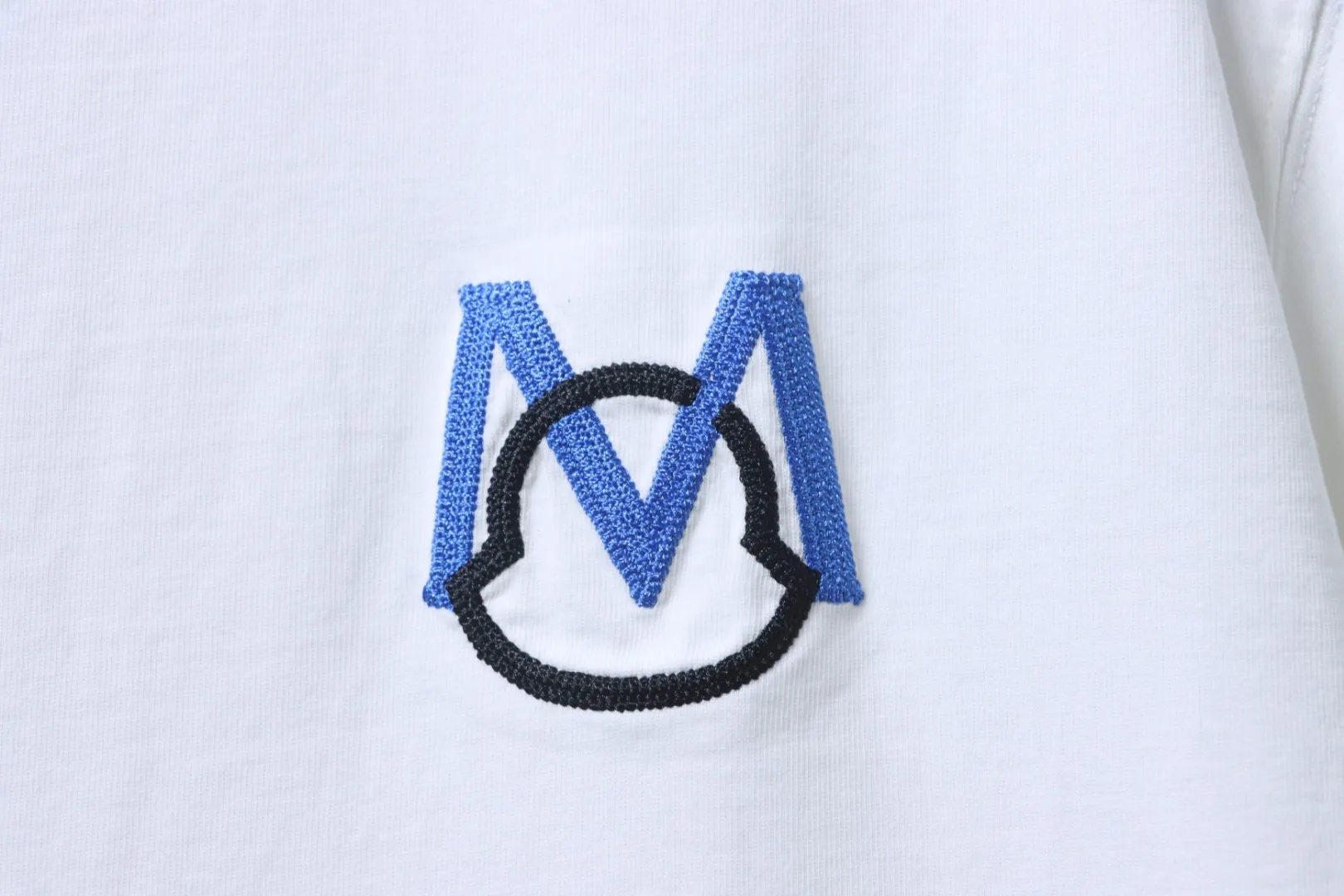 Moncler-Markenlogo