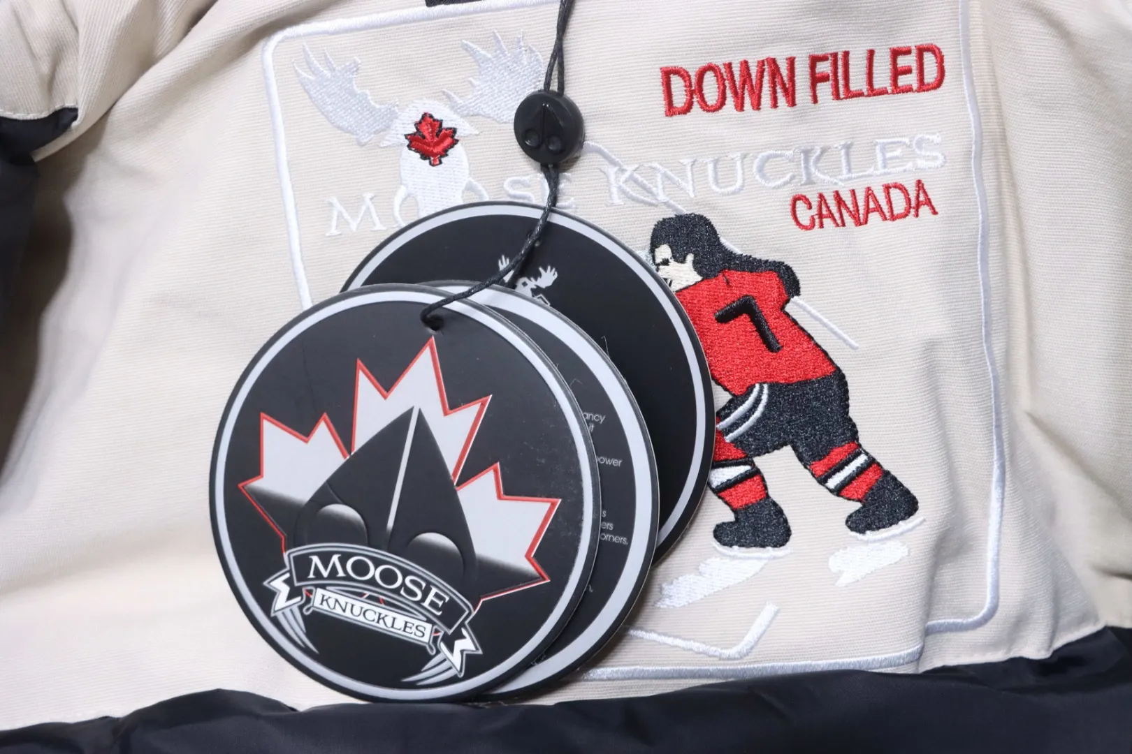 Moose Knuckles Hangtag