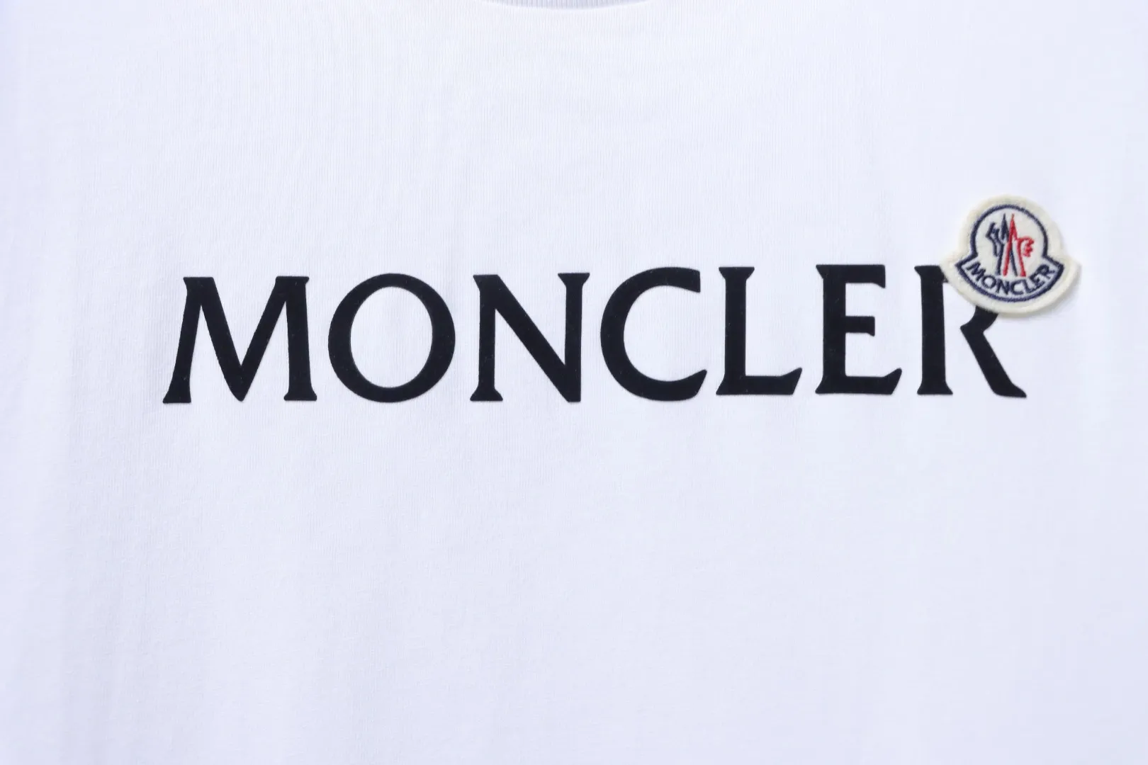 Moncler-Markenlogo