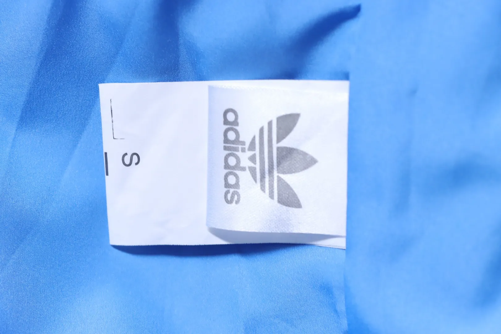 Adidas-Pflegeetikett